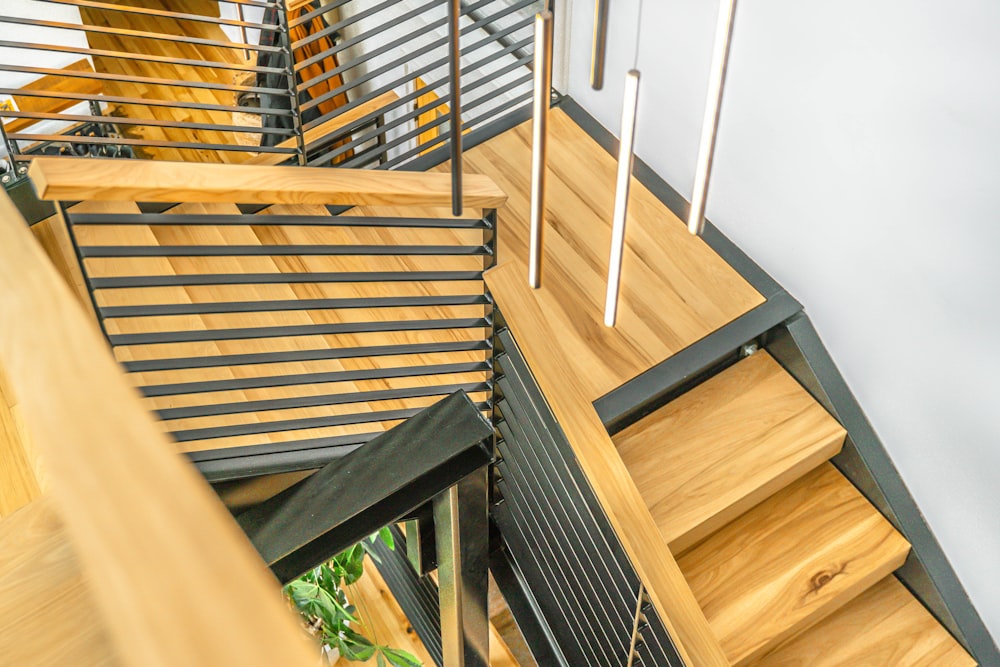 brown wooden stairs with gray metal railings