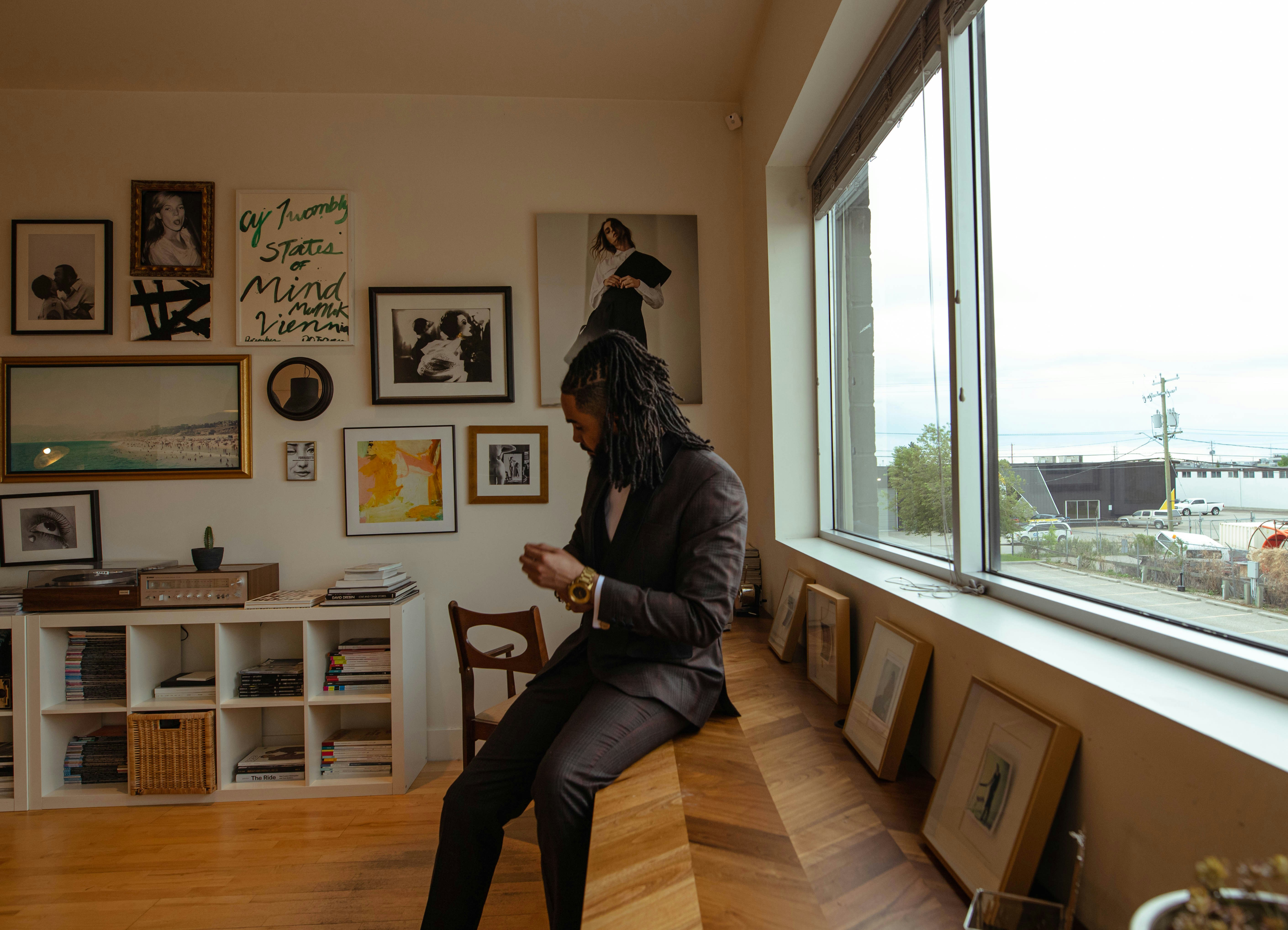 woman in black jacket and black pants sitting on chair