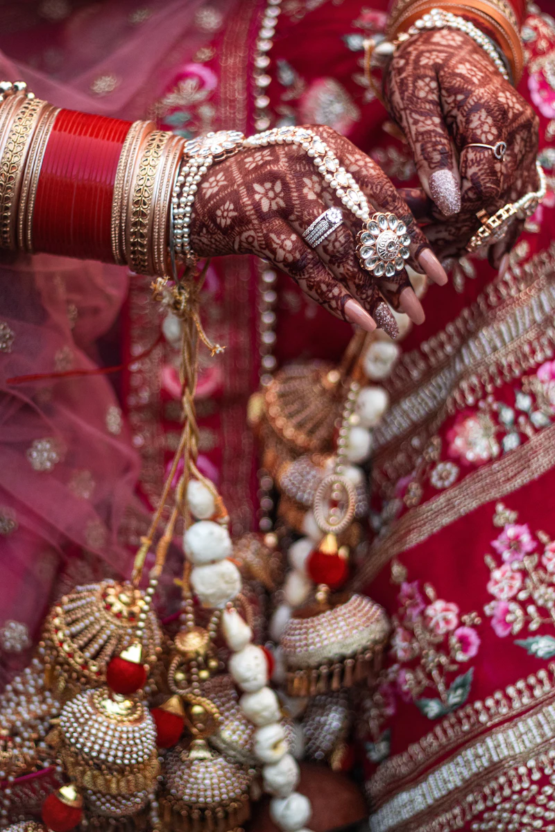 Eishah applying intricate bridal henna