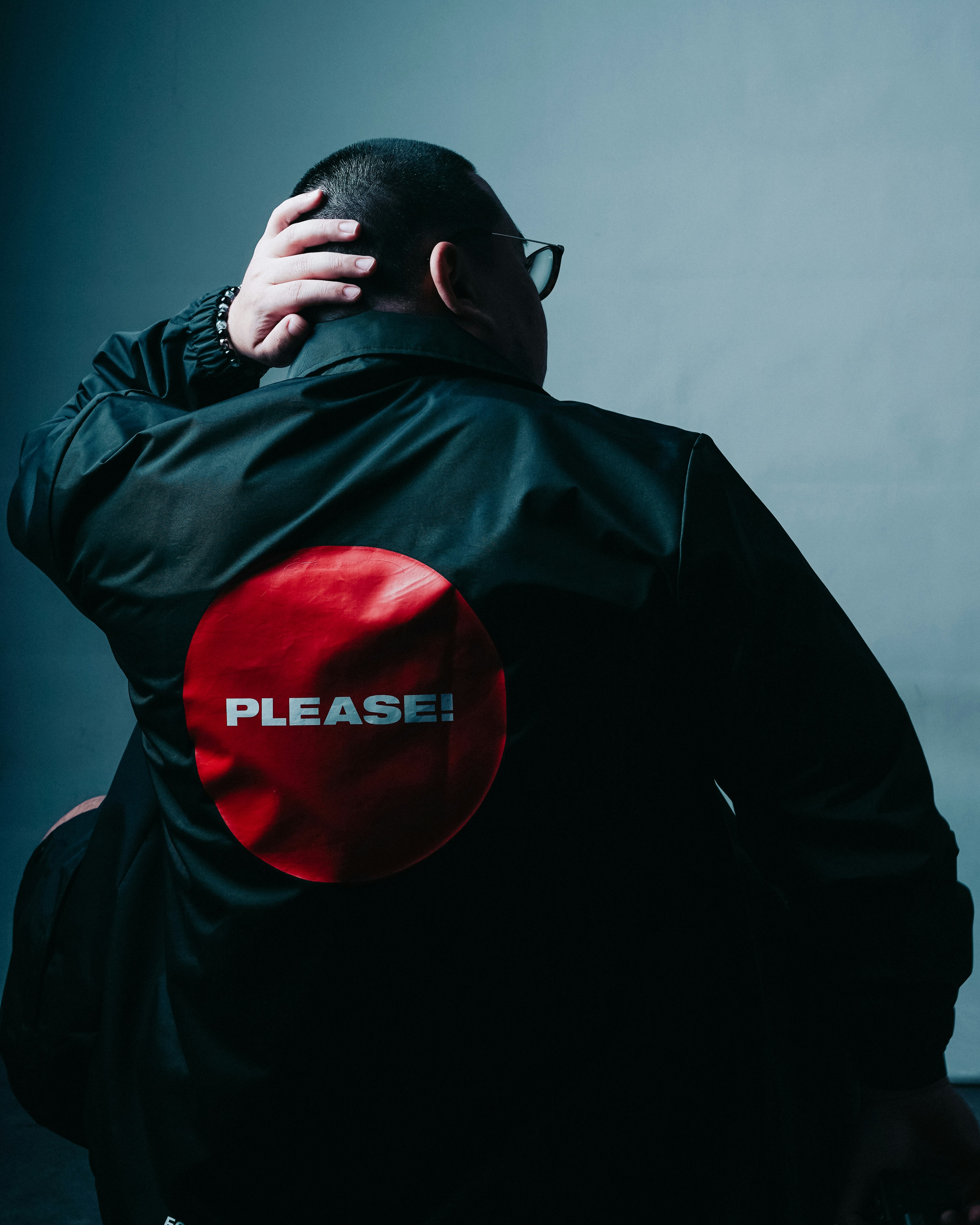 man in black leather jacket