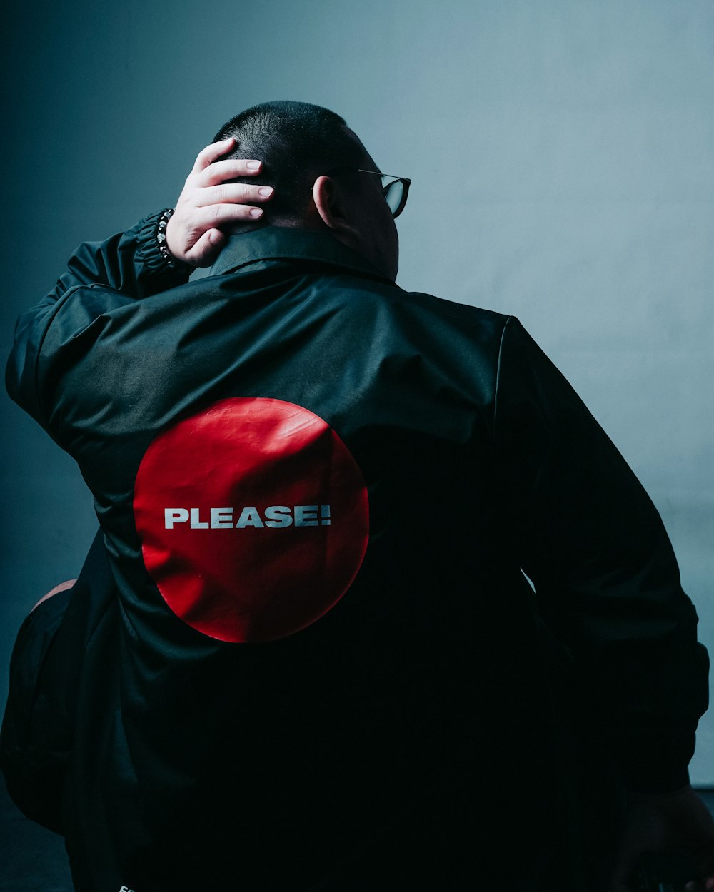 man in black leather jacket