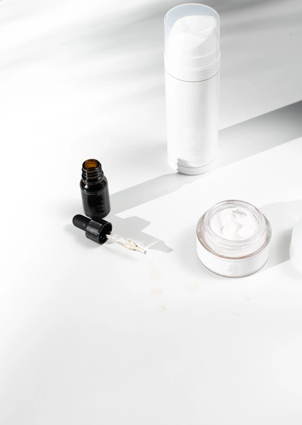 Dropper bottle, pump tube and open cream jar