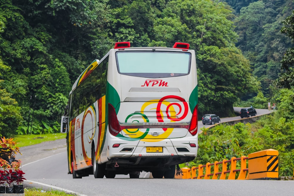 white red and yellow van on road during daytime