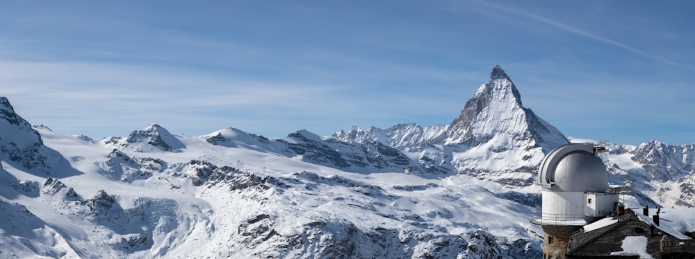 snow covered mountain under blue sky during daytime