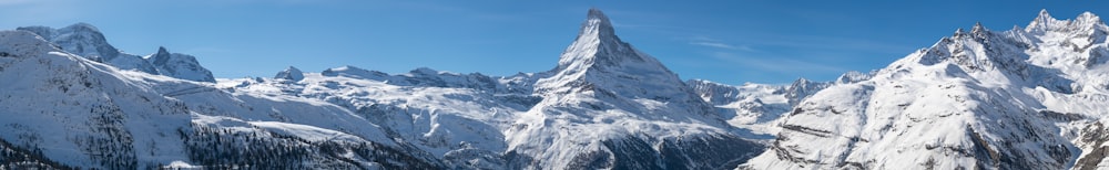 snow covered mountain under blue sky during daytime