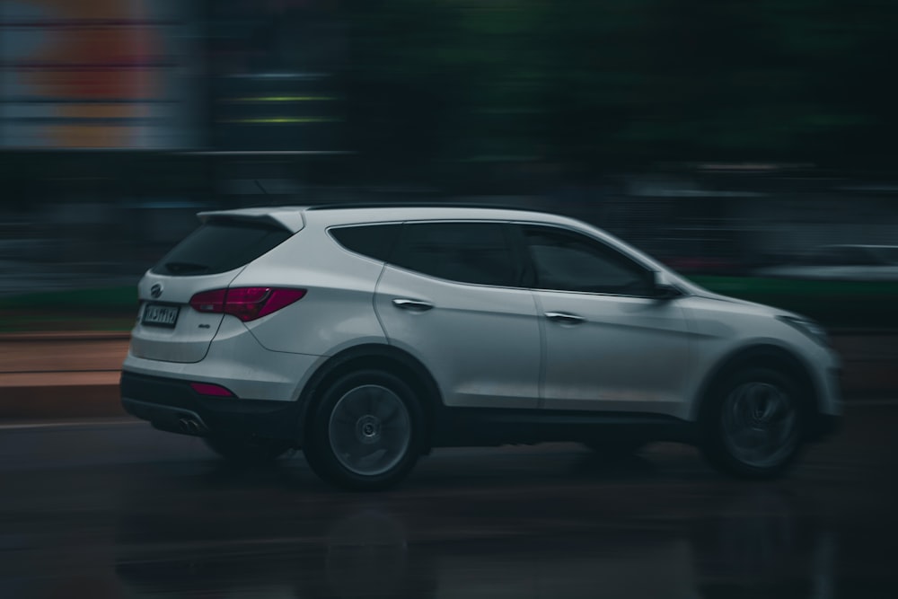 white honda sedan on road during night time