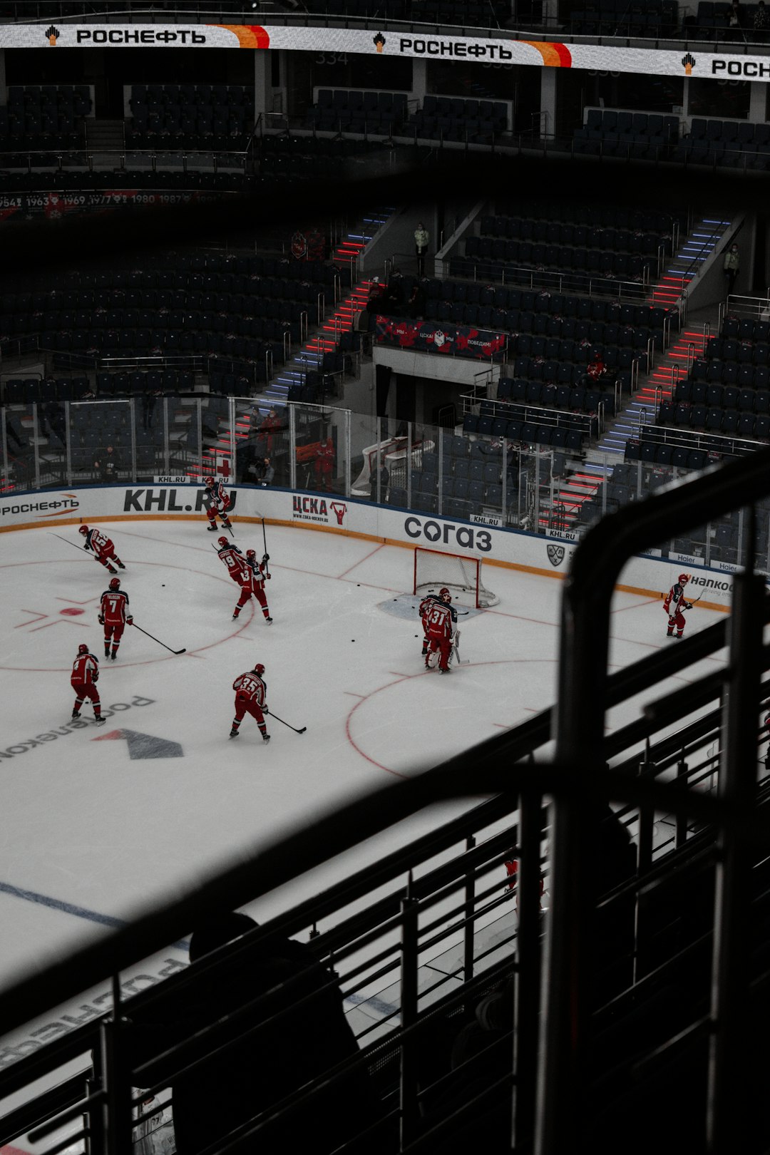 people playing ice hockey on court