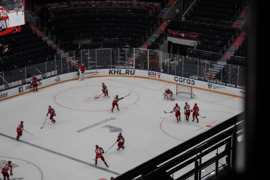 people playing ice hockey on ice stadium