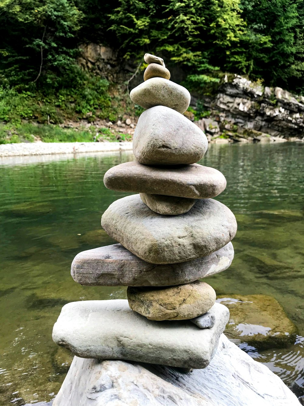 a stack of rocks sitting on top of a rock