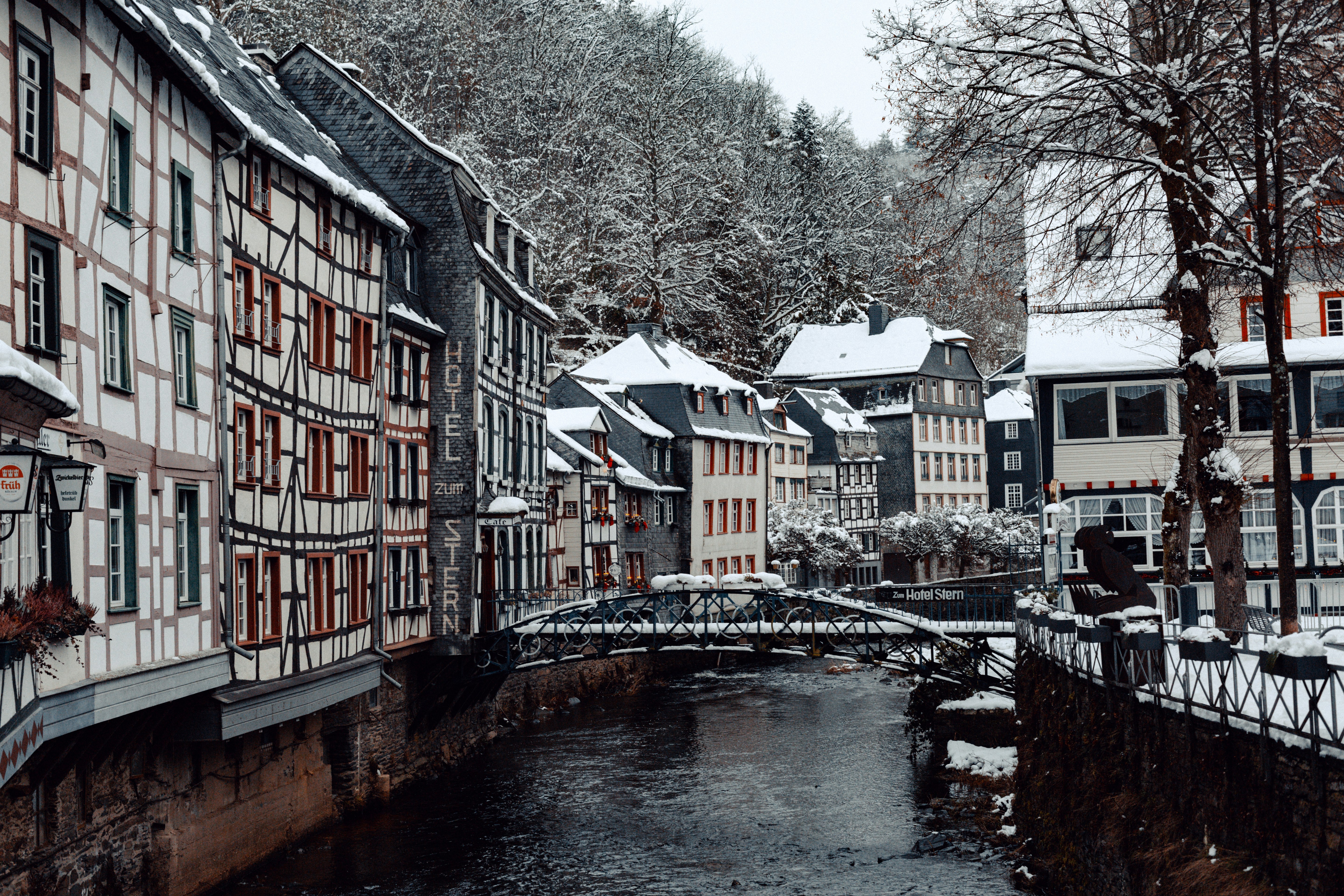 river between houses during daytime