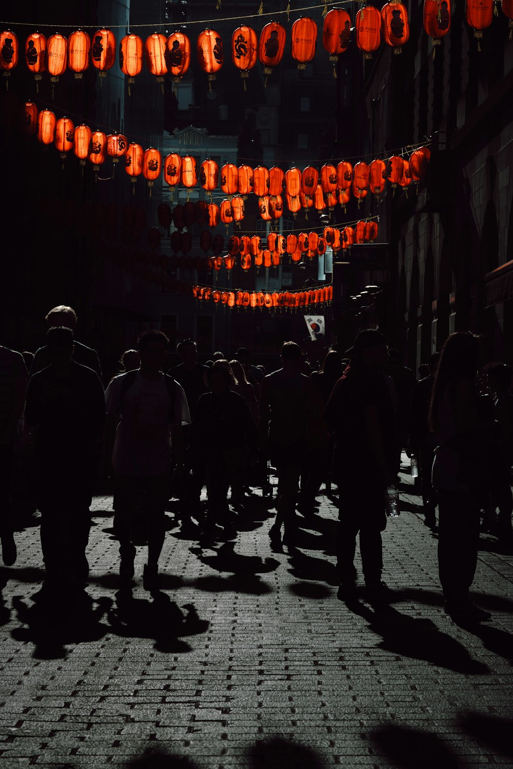 people walking on street during night time