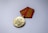 gold round coin on white table