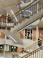Custom-designed steel staircase blending metal and concrete in a modern home.