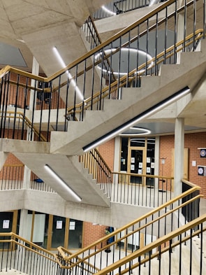 Custom-designed steel staircase blending metal and concrete in a modern home.