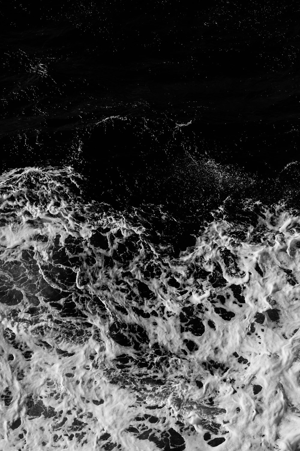 water waves in grayscale photography