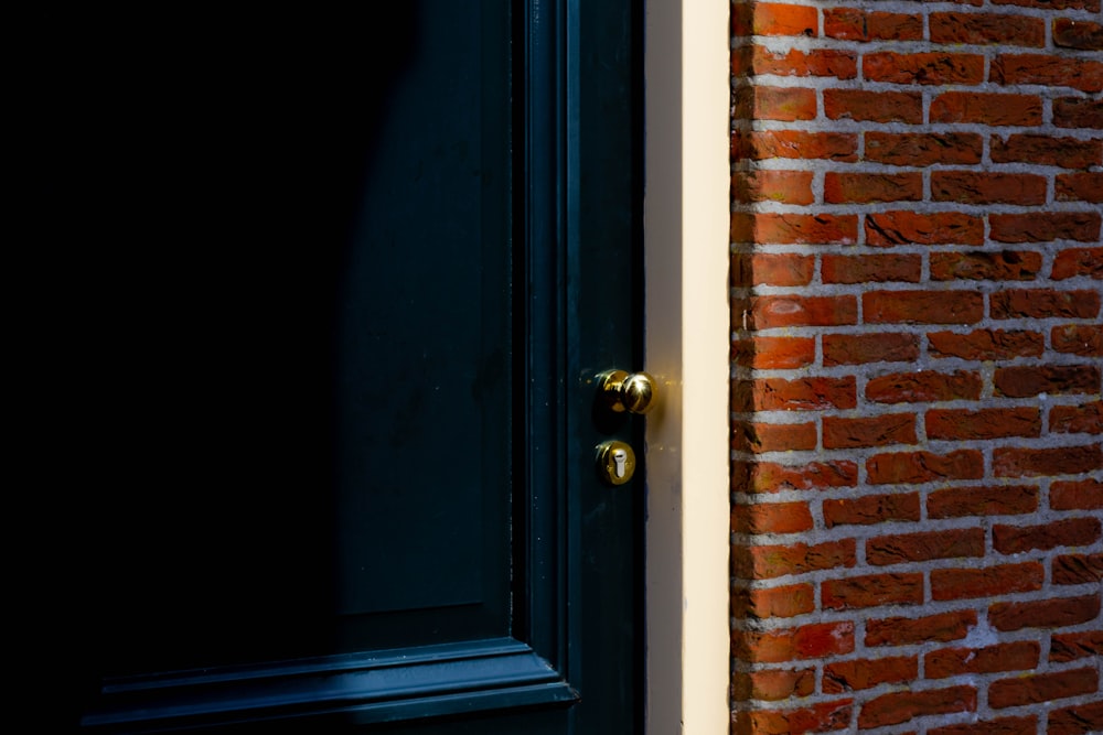 black wooden door with gold door knob