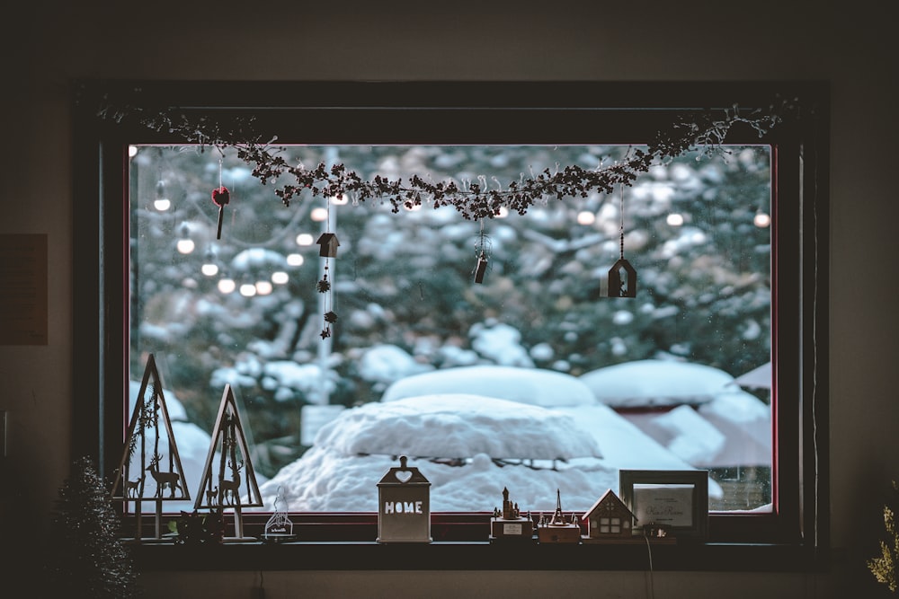 black flat screen tv turned on displaying snow covered mountains