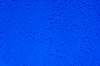 water droplets on blue surface