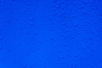 water droplets on blue surface