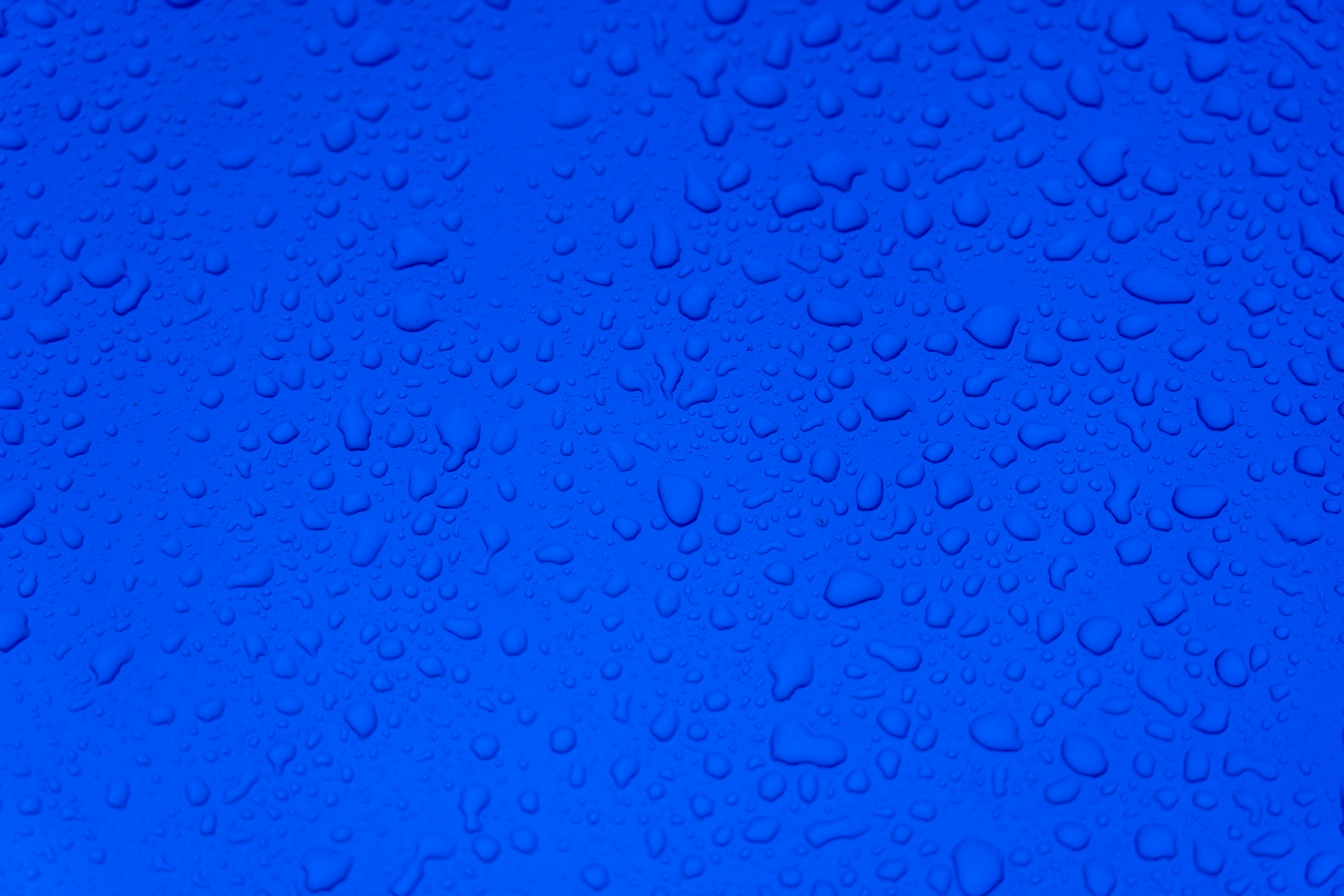 water droplets on blue surface