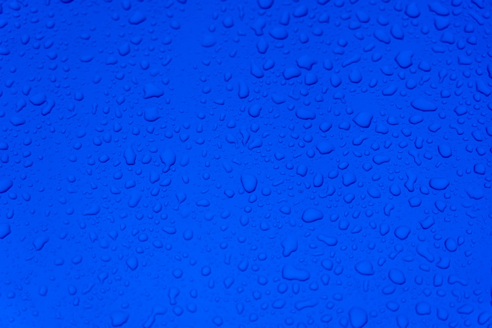 water droplets on blue surface