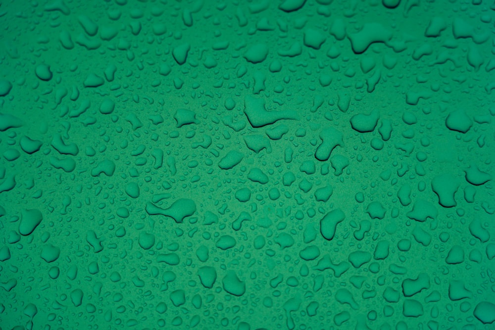 water droplets on blue surface