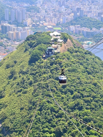 The ropeway gliding over Kharagpur Hill, offering breathtaking views of the heritage sites below.
