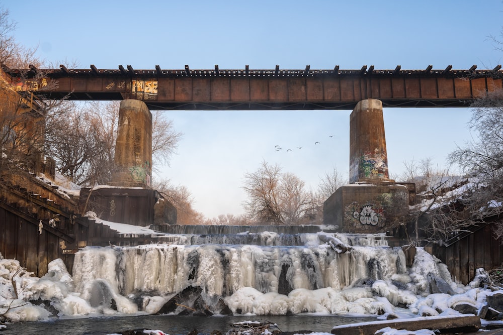 brown concrete bridge over water fountain