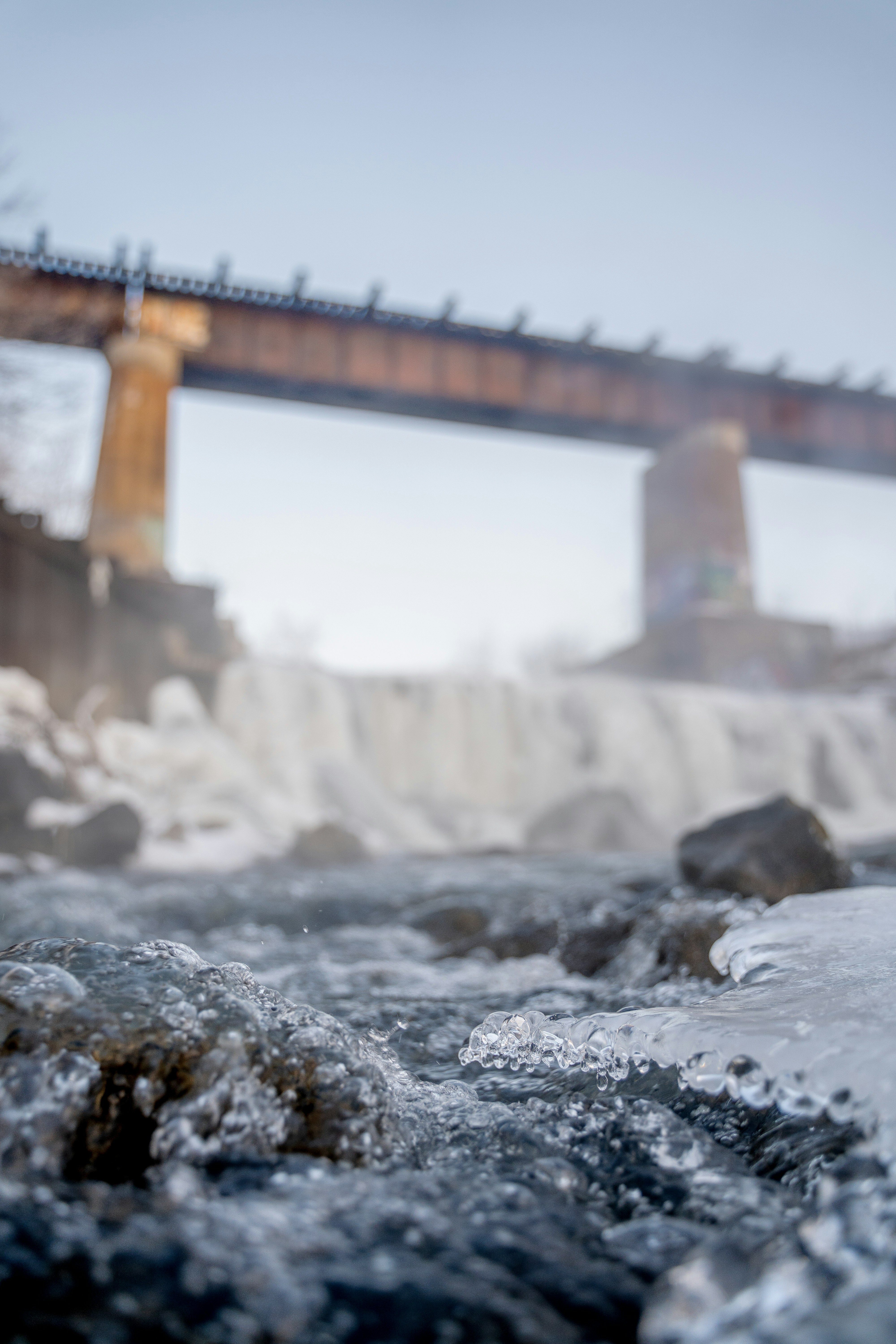 brown bridge over water during daytime