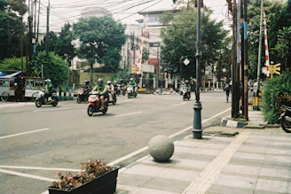 people riding motorcycle on road during daytime