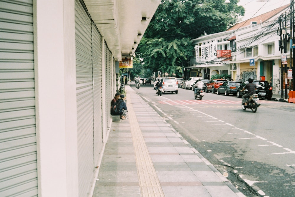 cars parked on sidewalk during daytime