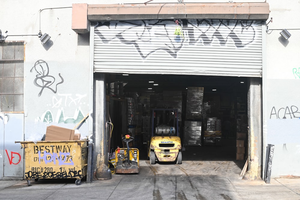 yellow and black auto rickshaw parked beside white and black store