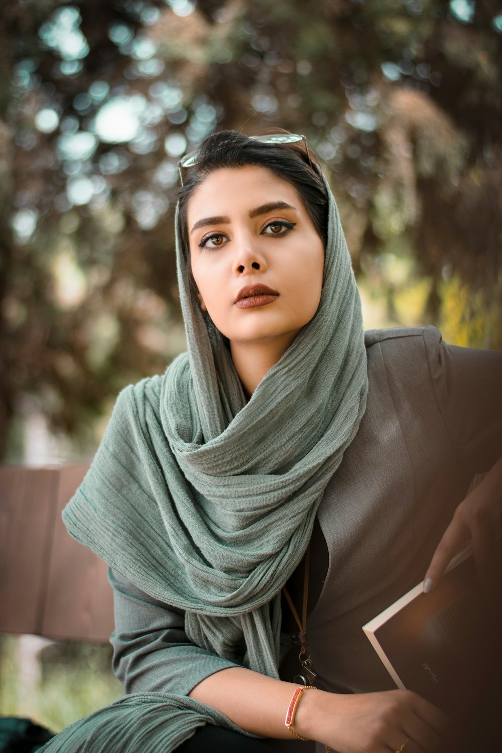 woman in gray hijab and black long sleeve shirt