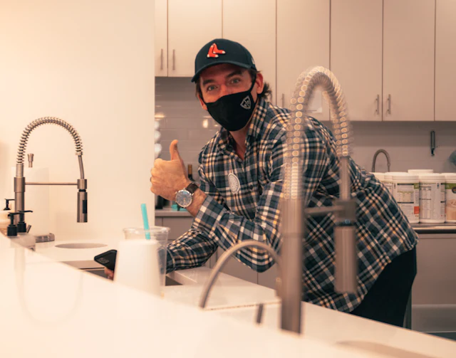 Plumber in work gear ready for a job