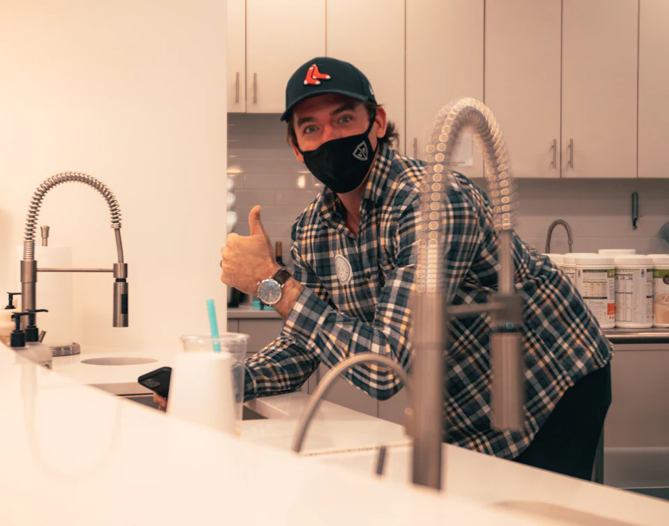 Plumber in work gear ready for a job — the kind of professional first impression your website should give