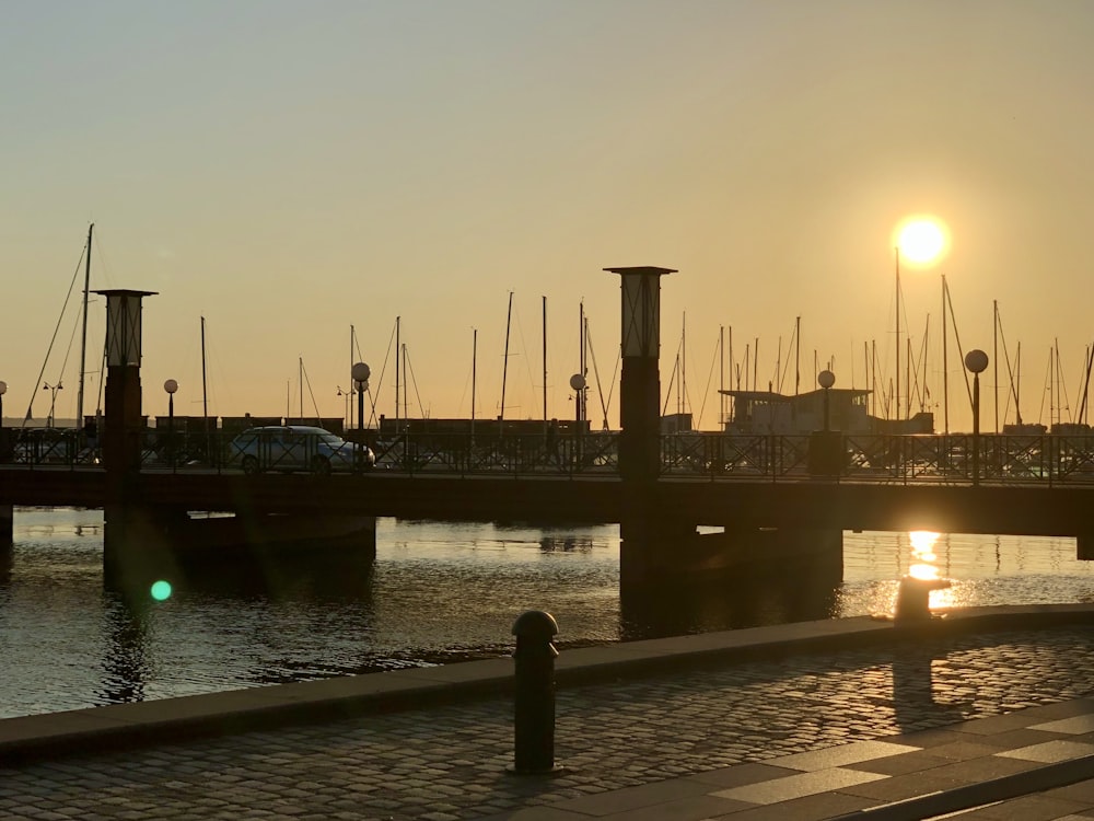 silhouette of dock during sunset