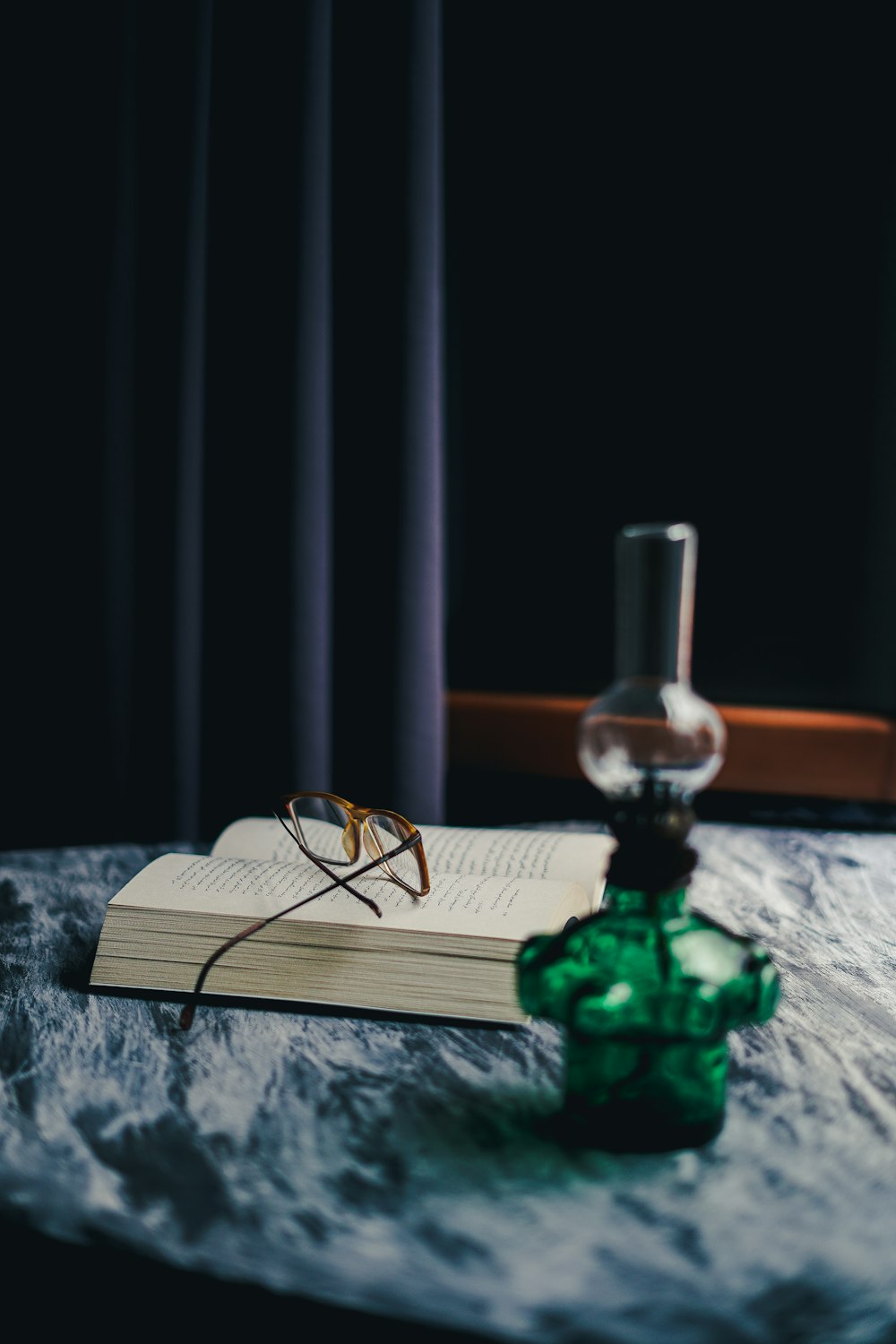 black framed eyeglasses on white book page