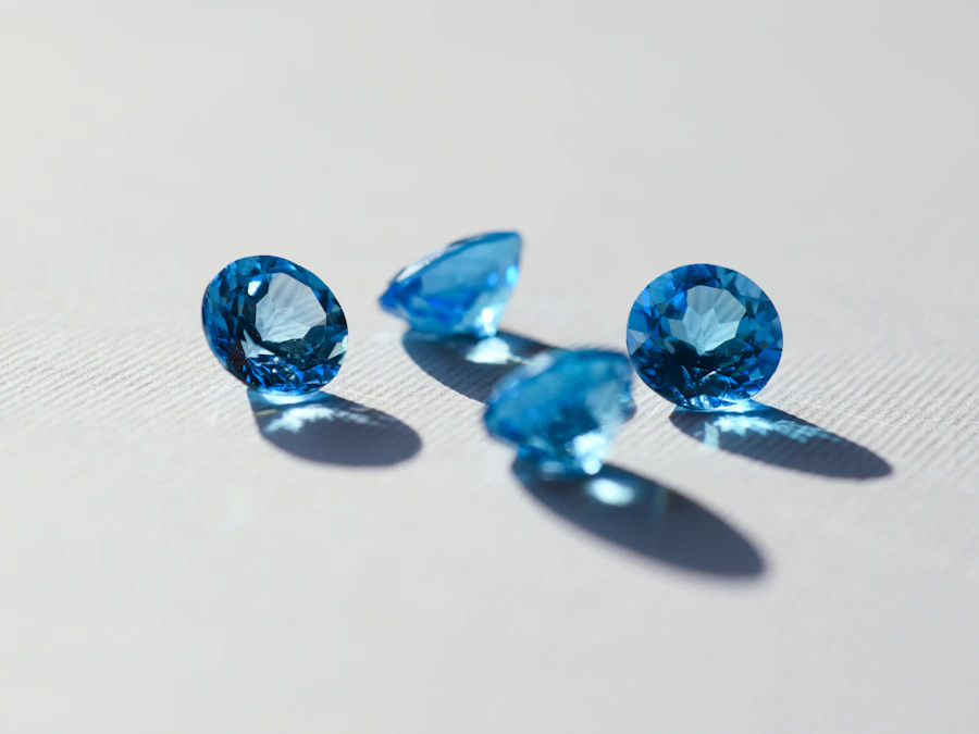 Faceted blue gemstones on a white surface
