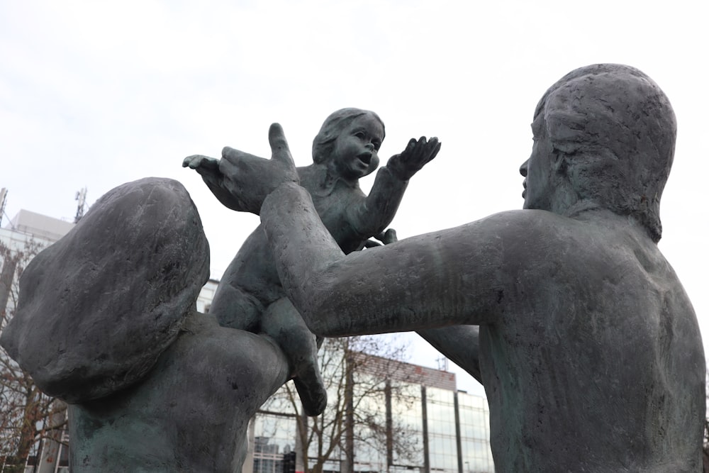 black statue of man and woman