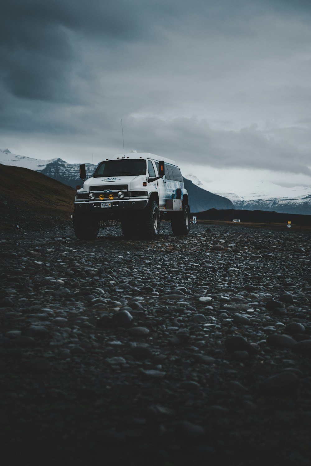 white chevrolet car on gray sand during daytime