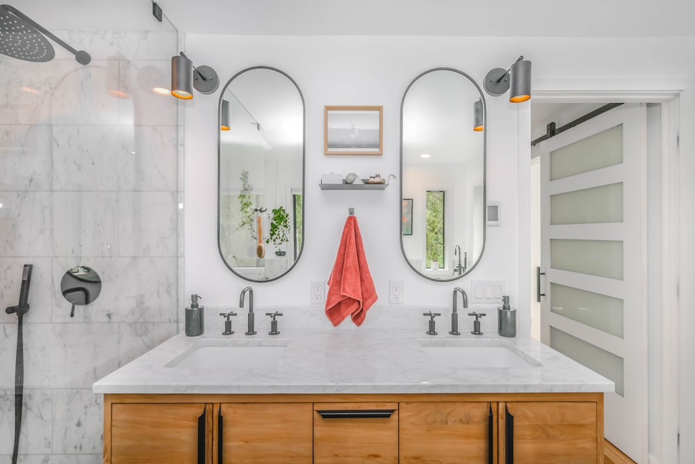 white ceramic sink with mirror