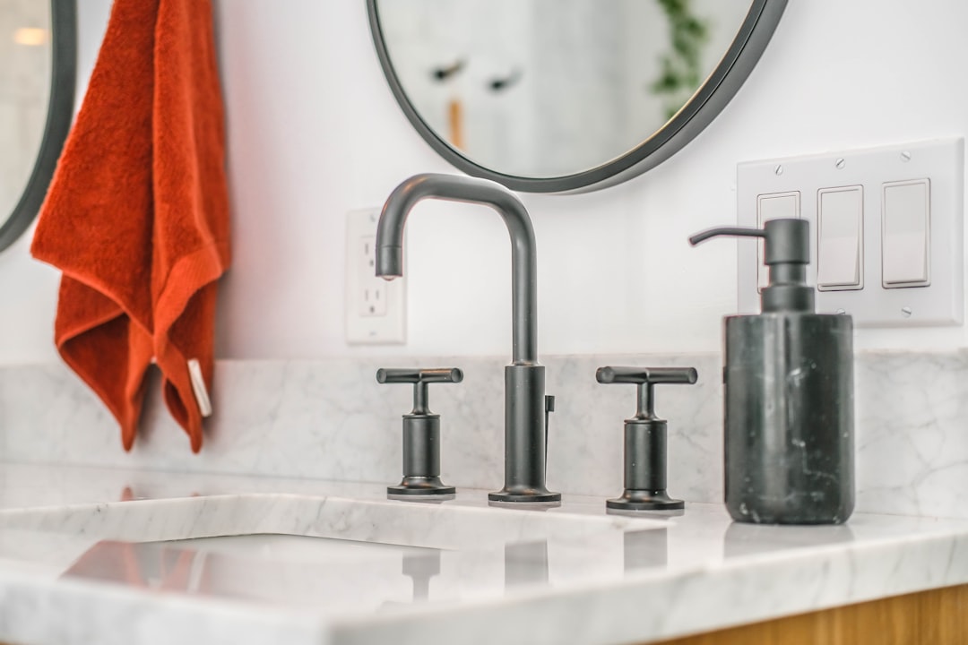 stainless steel faucet on white ceramic sink, bathroom sink