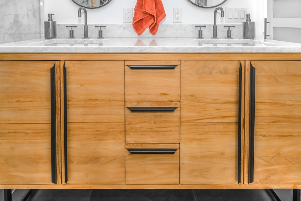 brown wooden cabinet with mirror