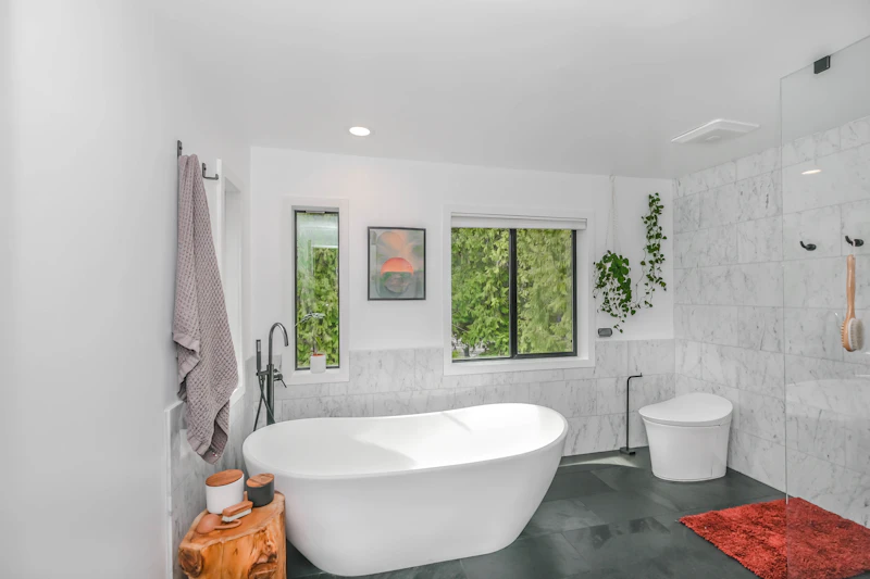 Non Slip Bath Mat in Appleton — Modern white bathtub in a tiled bathroom