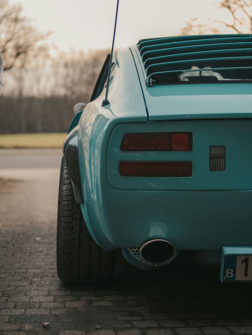 blue car on road during daytime