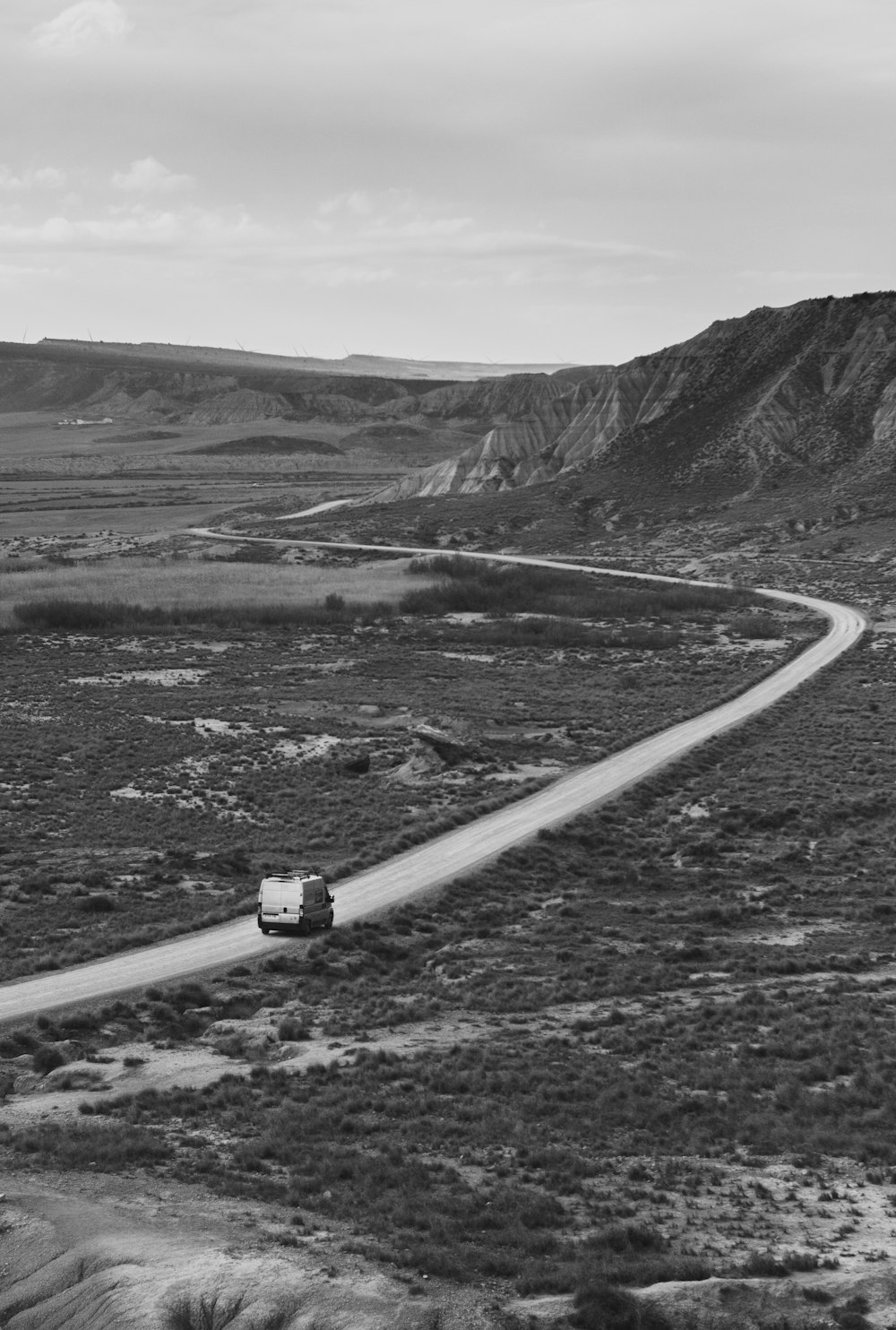 grayscale photo of car on road