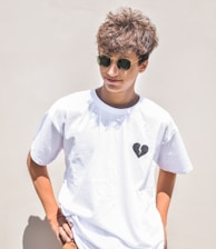 boy in white crew neck t-shirt wearing black sunglasses