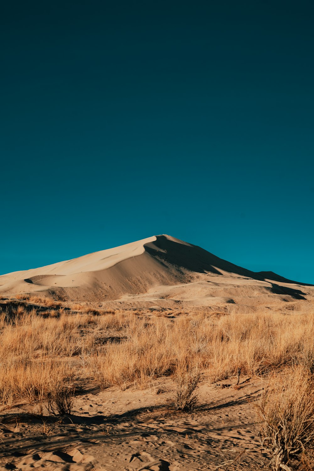 brown mountain under blue sky during daytime