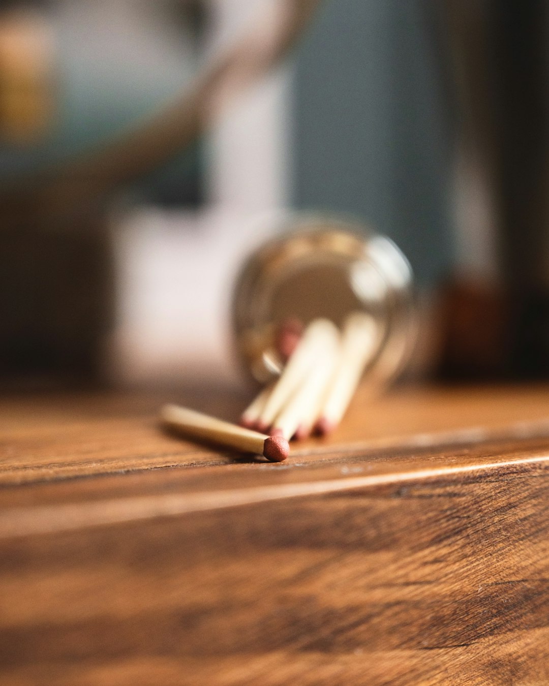 white and red cigarette stick on brown wooden table