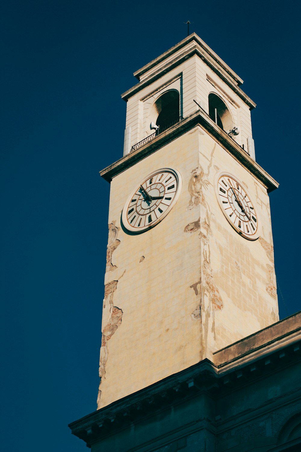 brown concrete tower with analog clock